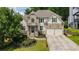 Charming two-story home with stone and siding exterior, landscaped front yard, and a two-car garage at 454 Pine Bluff Dr, Dallas, GA 30157