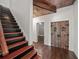 Hallway features decorative doors, brick accents, and staircase to the second floor at 454 Pine Bluff Dr, Dallas, GA 30157