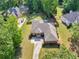 Aerial view of house on large lot, features long driveway and mature landscaping at 570 Mcgarity Dr, Mcdonough, GA 30252