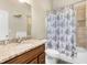 Bathroom featuring a vanity with granite countertop, a toilet, and a shower with shower curtain at 570 Mcgarity Dr, Mcdonough, GA 30252