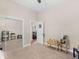 Bedroom featuring carpet, ceiling fan, an entry door, a closet with sliding mirror doors, and two chairs at 570 Mcgarity Dr, Mcdonough, GA 30252