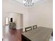 Open dining room features hard wood floors and a view through the living room at 570 Mcgarity Dr, Mcdonough, GA 30252