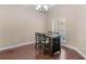 Dining room area featuring natural light, hardwood floors and modern chandelier at 570 Mcgarity Dr, Mcdonough, GA 30252