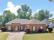 Lovely brick home with manicured lawn and landscaping showcasing curb appeal at 570 Mcgarity Dr, Mcdonough, GA 30252