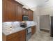 Kitchen boasts granite counters, stainless appliances, and custom backsplash at 570 Mcgarity Dr, Mcdonough, GA 30252