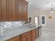 The kitchen features granite countertops, custom tile backsplash, and a stainless steel dishwasher at 570 Mcgarity Dr, Mcdonough, GA 30252