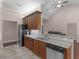 Spacious kitchen with granite countertops, stainless steel appliances, and dark wood cabinets at 570 Mcgarity Dr, Mcdonough, GA 30252