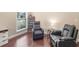 Bright living area with hardwood floors, high ceilings, and comfortable furniture at 570 Mcgarity Dr, Mcdonough, GA 30252