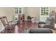 Cozy living room showcasing hardwood floors, natural light, and comfortable seating at 570 Mcgarity Dr, Mcdonough, GA 30252