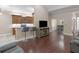 Living room with open concept and bar seating connecting to the kitchen and breakfast nook at 570 Mcgarity Dr, Mcdonough, GA 30252