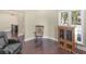 Living room area with hardwood flooring, furniture, and natural lighting at 570 Mcgarity Dr, Mcdonough, GA 30252