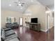 Spacious living room featuring hardwood floors, vaulted ceilings, and modern furnishings at 570 Mcgarity Dr, Mcdonough, GA 30252
