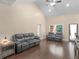 Bright and airy living room with hardwood floors, high ceilings, and stylish sofas at 570 Mcgarity Dr, Mcdonough, GA 30252