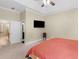Bright main bedroom with tray ceilings and ensuite bath and closet at 570 Mcgarity Dr, Mcdonough, GA 30252