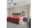 Bright main bedroom with tray ceilings and natural light from two windows at 570 Mcgarity Dr, Mcdonough, GA 30252