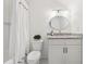 Bathroom featuring a shower/tub combo, framed mirror, and granite countertop vanity at 214 Trecastle Sq, Canton, GA 30114