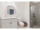Stylish bathroom with a glass shower, white vanity, and modern fixtures at 214 Trecastle Sq, Canton, GA 30114