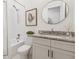 Clean bathroom featuring a shower/tub combo and granite countertop vanity at 214 Trecastle Sq, Canton, GA 30114