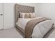 Comfortable bedroom featuring a tufted headboard and cozy bedding at 214 Trecastle Sq, Canton, GA 30114