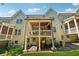 Beautiful townhouse back exterior with a covered patio and outdoor seating area at 214 Trecastle Sq, Canton, GA 30114
