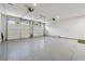 Spacious garage with epoxy flooring and two car doors at 214 Trecastle Sq, Canton, GA 30114