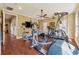 Well-equipped home gym featuring modern exercise equipment and hardwood floors at 214 Trecastle Sq, Canton, GA 30114