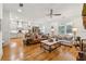 Spacious open-concept living area features hardwood floors connecting the kitchen and a cozy living room at 214 Trecastle Sq, Canton, GA 30114