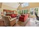 Bright living room with hardwood floors, high ceilings, and multiple windows at 214 Trecastle Sq, Canton, GA 30114