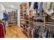 Organized walk-in closet featuring shelving for shoes and hanging clothes at 214 Trecastle Sq, Canton, GA 30114