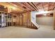 Unfinished basement ready to be customized, with exposed beams, studs and stairs at 381 New Jersey Ave Nw, Atlanta, GA 30314