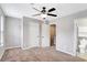 Bedroom with carpet, ceiling fan, and ensuite bathroom entrance at 381 New Jersey Ave Nw, Atlanta, GA 30314