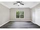 Spacious bedroom with ceiling fan, large window, and hardwood-style floors at 381 New Jersey Ave Nw, Atlanta, GA 30314