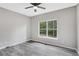 Bedroom with LVP flooring, neutral walls, and a view of the backyard at 381 New Jersey Ave Nw, Atlanta, GA 30314