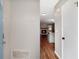 Entryway with wood floors, coat hooks, door and view to the kitchen, living room and fireplace at 381 New Jersey Ave Nw, Atlanta, GA 30314
