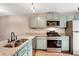 Modern kitchen featuring granite countertops, stainless steel appliances, and ample cabinet space at 381 New Jersey Ave Nw, Atlanta, GA 30314