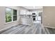 Bright eat-in kitchen with white cabinets, granite countertops, and stainless steel appliances at 381 New Jersey Ave Nw, Atlanta, GA 30314