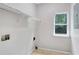 Laundry room featuring a window, wire rack and tile flooring at 381 New Jersey Ave Nw, Atlanta, GA 30314