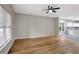 Spacious living room with hardwood floors and ample natural light, seamlessly connected to the kitchen at 381 New Jersey Ave Nw, Atlanta, GA 30314