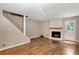 Spacious living room featuring a fireplace and hardwood flooring at 381 New Jersey Ave Nw, Atlanta, GA 30314