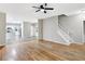 Open-concept layout featuring hardwood floors, stairs, and smooth flow into the kitchen at 381 New Jersey Ave Nw, Atlanta, GA 30314