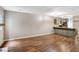 Expansive living area with hardwood flooring and a kitchen breakfast bar at 381 New Jersey Ave Nw, Atlanta, GA 30314