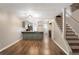 Open concept living space with kitchen, stairs and hardwood flooring at 381 New Jersey Ave Nw, Atlanta, GA 30314
