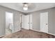 Spacious main bedroom with ceiling fan, carpet, three closets, and ensuite bathroom access at 381 New Jersey Ave Nw, Atlanta, GA 30314