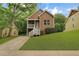 Charming two-story home featuring a welcoming front porch and well-manicured lawn at 381 New Jersey Nw Ave, Atlanta, GA 30314