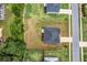 Aerial view of a house and yard with a large driveway and view of the street at 4323 Cannon Walk, Ellenwood, GA 30294
