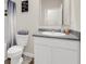 Bathroom featuring a white vanity, toilet, and modern mirror at 4323 Cannon Walk, Ellenwood, GA 30294