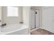 Bathroom featuring a tub, shower, and tile flooring at 4323 Cannon Walk, Ellenwood, GA 30294