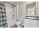 Full bathroom featuring a shower and tub combo, toilet, and a grey countertop sink at 4323 Cannon Walk, Ellenwood, GA 30294