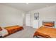 Comfortable bedroom featuring two twin beds with grey carpet and a white dresser at 4323 Cannon Walk, Ellenwood, GA 30294