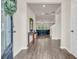 Inviting foyer with hardwood floors, an elegant table, and a view into the living area at 4323 Cannon Walk, Ellenwood, GA 30294